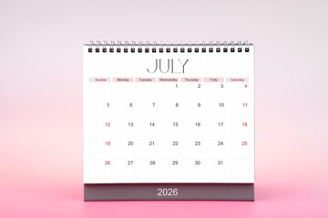 Desktop monthly calendar for July 2026 on pink color background.