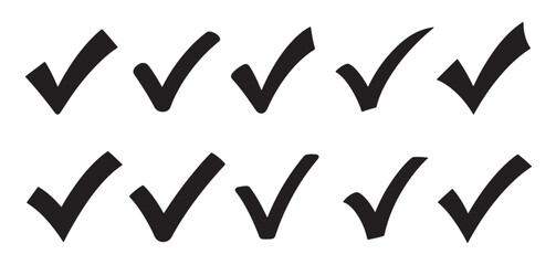 Collection of hand drawn check mark symbols in black silhouette