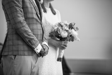 Wedding day. Close-up of brides hands with wedding flowers. Wedding inspiration, bridal accessories 