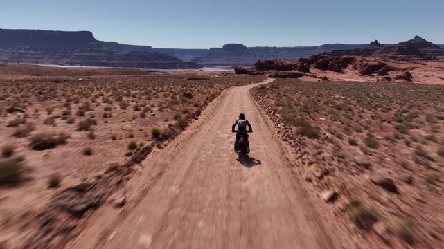 Solitary Rider on Desert Track along potash ponds