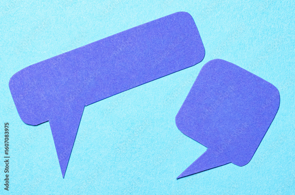 Fototapete blank cut out paper speech bubbles with copy space for text on blue background, flat lay top view co