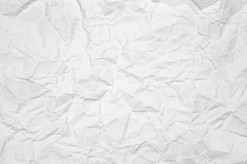 High-contrast white crumpled paper texture. This abstract, wrinkled background is perfect as a creased poster overlay or for a grunge design.