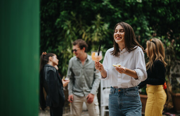 Friends having a great time outdoors sharing drinks, laughter, and friendly moments in a lush garden. The cheerful atmosphere and casual setting make the scene memorable and full of joy.