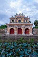Obraz premium Traditional Vietnamese Temple Gate in Garden Setting