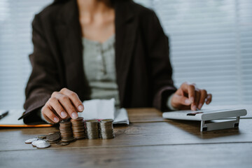 Unrecognizable woman holds receipts pencil uses laptop plans budget manages expenses calculates...