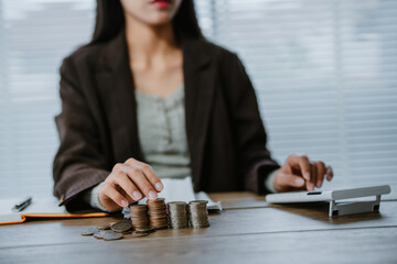 Unrecognizable woman holds receipts pencil uses laptop plans budget manages expenses calculates...