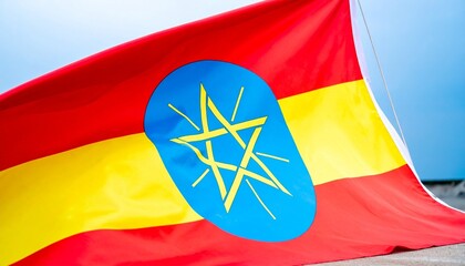 Ethiopia’s national flag—three horizontal stripes: green (top), yellow (middle), red (bottom); blue circle with yellow pentagram centered