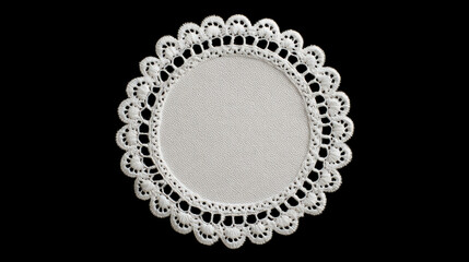 Decorative round white lace doily with intricate pattern on black
