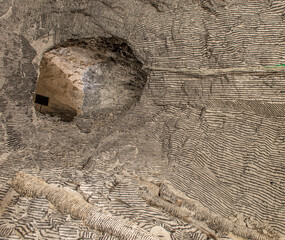 Interior of the Dossena mine with colored stones for an artistic installation.