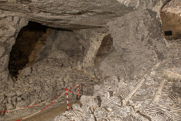 Interior of the Dossena mine with colored stones for an artistic installation.