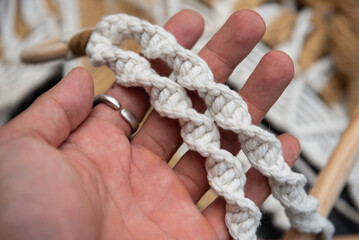 Handmade macrame on space background.