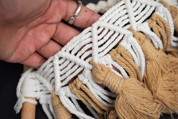 Handmade macrame on space background.