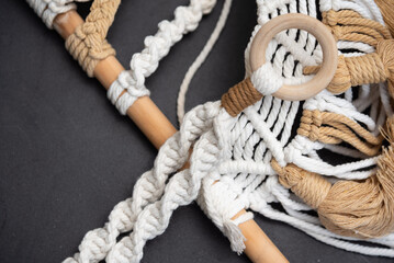 Handmade macrame on space background.