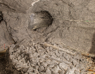 Interior of the Dossena mine with colored stones for an artistic installation.
