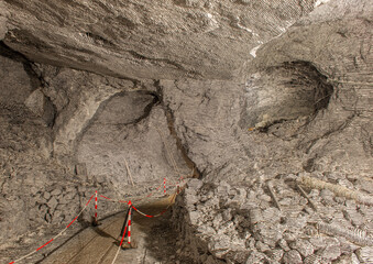Interior of the Dossena mine with colored stones for an artistic installation.