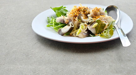 Mekong giant catfish steamed with herbs such as lemongrass and kaffir lime leaves to reduce fishy smell and increase the aroma. Steamed fish topped with Chinese celery and fried garlic. Healthy menu.
