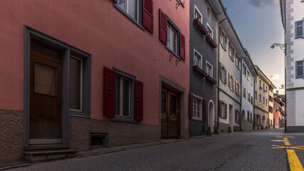 Sunset on the medieval streets in the center of Thusis in Switzerland