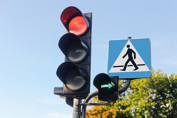 Urban traffic control concept. Red traffic light with pedestrian crossing sign. Road safety...