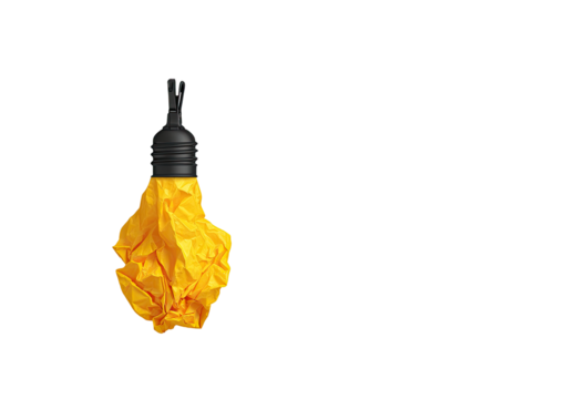 Crumpled yellow lightbulb against black background