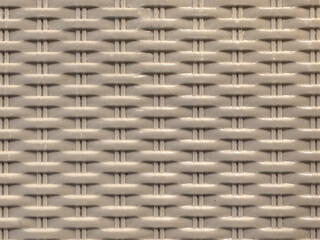 Close up of white synthetic rattan texture or wicker weaving. Plastic rattan colors. Unique and antique combination, seamless background texture.