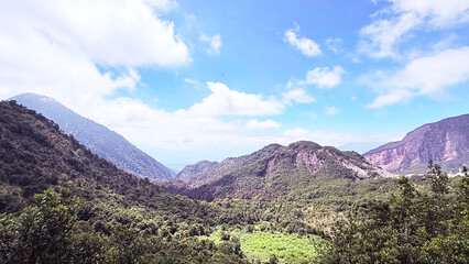 Vast Green Mountains Valley Under Blue Sky Natural Landscape