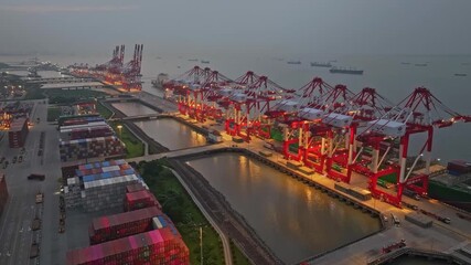 Industrial Seascape: Busy Shanghai Waigaoqiao port area at night - Powered by Adobe