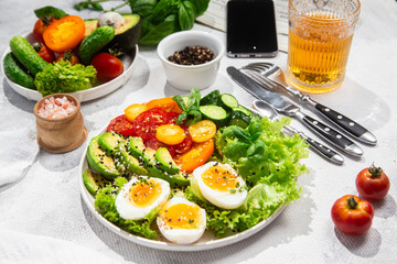 Healthy Salad Bowl with Avocado, Eggs, Tomatoes and Cucumbers, 