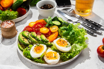 Healthy Salad Bowl with Avocado, Eggs, Tomatoes and Cucumbers, 
