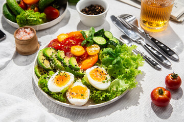 Healthy Salad Bowl with Avocado, Eggs, Tomatoes and Cucumbers, 