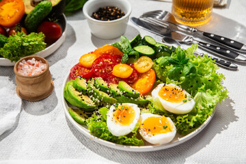 Healthy Salad Bowl with Avocado, Eggs, Tomatoes and Cucumbers, 