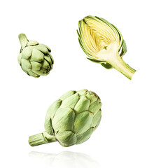 Fresh raw Artichoke falling in the air isolated on white background. High resolution image