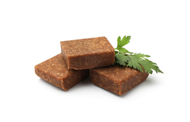 Aromatic bouillon cubes and parsley isolated on white