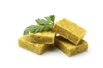 Aromatic bouillon cubes and parsley isolated on white