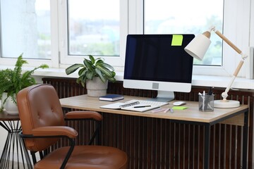 Stylish workplace with modern computer on wooden desk