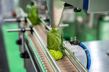 Tablet, Capsule counting machine conveyor in production line of pharmaceutical industry.