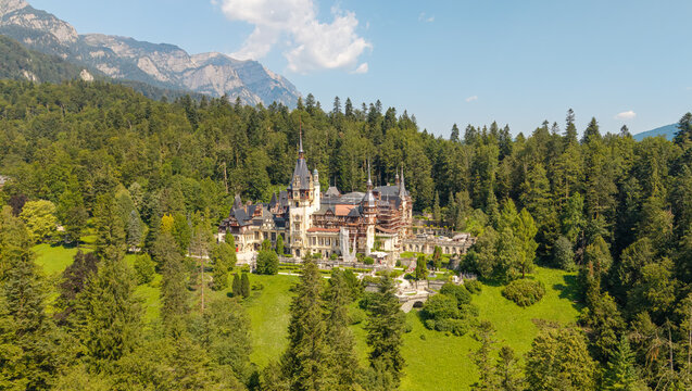 Aerial drone view of the beautiful Peles Castle in Sinaia, Transylvania, Romania, during the summer season.