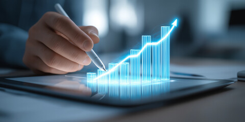 Person uses stylus on digital tablet to interact with glowing 3D graph, symbolizing growth and success in business. futuristic setting highlights technology role in data analysis