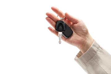 Hand holding car keys on isolated background. Concept of selling or renting a car
