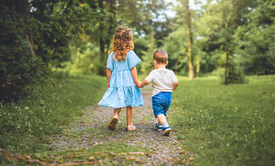 Fototapeta premium Brother and sister on summer season forest