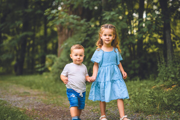 Fototapeta premium Brother and sister on summer season forest