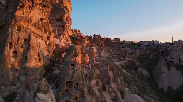 Aerial evening view Ancient Uchisar castle, underground city of Cappadocia Turkey, Goreme national park.