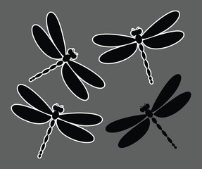Black dragonfly silhouettes arranged in a playful pattern white wings