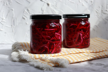 Homemade pickled purple cabbage in glass bottles. Probiotics food.