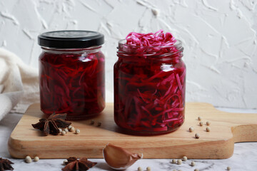Homemade pickled purple cabbage in glass bottles. Probiotics food.