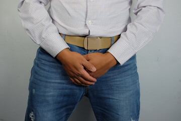 Erectile dysfunction concept. Close up of man holding his crotch. Men's health. Man holding genitals. Men's health, venereologist, sexual disease
