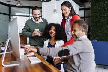 latin business people having a discussion and working in an office in Mexico Latin America,...