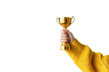A hand holding a golden trophy against a black background.  A mustard yellow sweater is visible