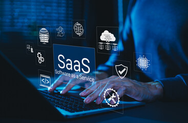 SaaS Software as a Service Digital Cloud Technology. Hands typing on laptop with SaaS icons...