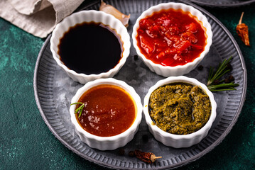 Set of different sauces. Ketchup, mustard, pesto