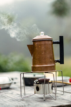 Camp coffee on a burner outside in summer